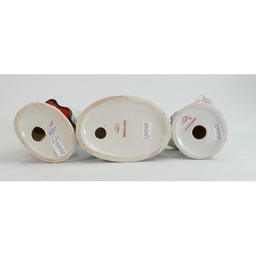 654 - Russian Lomonosov pottery figures of Eskimos: Height of tallest 19cm. (3)