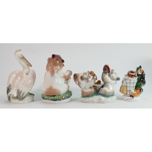 657 - Russian Lomonosov pottery figures of comical bears and a pelican: Height of tallest 19cm. (4)