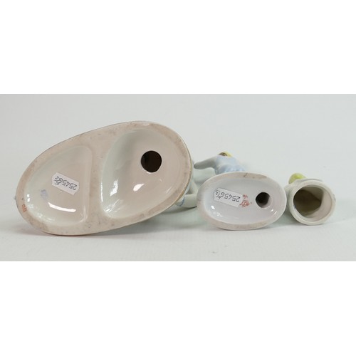 658 - Russian Lomonosov pottery figures of a skater, bather and young child: Height of tallest 18cm. (3)