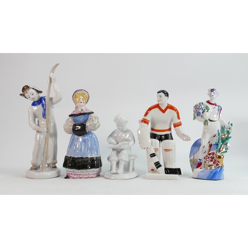 660 - Russian pottery figures of: Ice Hockey Players, Skiers, Jester, Pierrot, Ethnic woman etc., height o... 