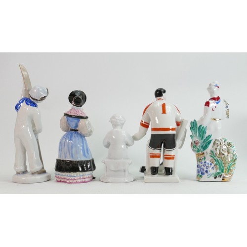 660 - Russian pottery figures of: Ice Hockey Players, Skiers, Jester, Pierrot, Ethnic woman etc., height o... 