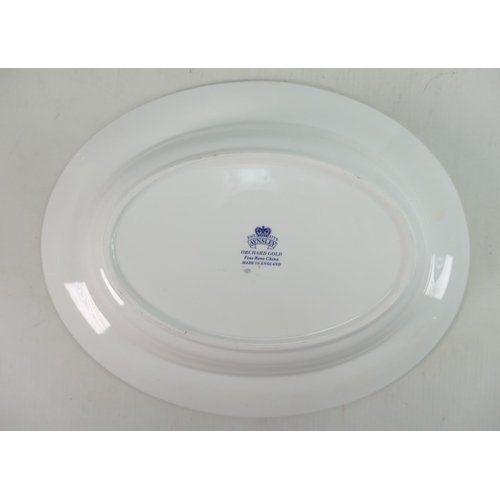 1150 - Aynsley Orchard Gold dinner set: Comprising various size plates, bowls, tureen & cover, candlesticks... 