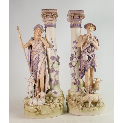 638 - Large pair of Royal Dux figures: Girl & boy standing with sheep by architectural columns, circa 1900... 