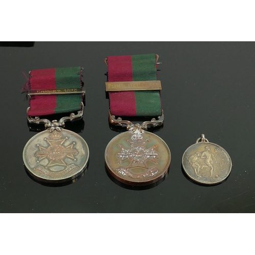 1538 - A collection of military and sporting medals: To include 1933 football medal awarded to 4969817 Lanc... 