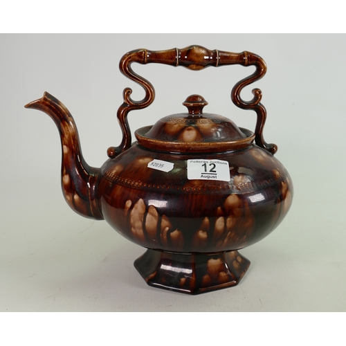 12 - Unusual early 19th century pottery treacle glaze tea pot: A larger item measuring 27 cm wide x 24 cm... 