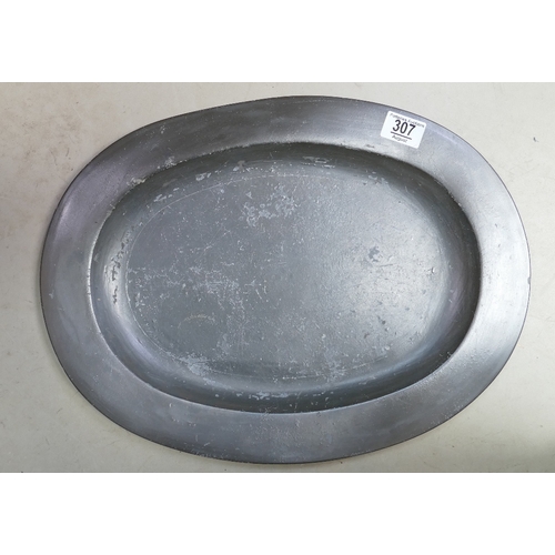 307 - Large 18th or 19th century pewter oval platter: Measuring 46cm wide, with touch marks and initials t... 