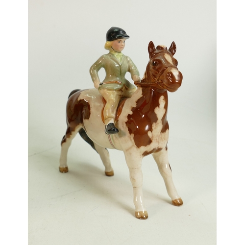 169 - Beswick girl on skewbald pony 1499: repaired boots & front leg