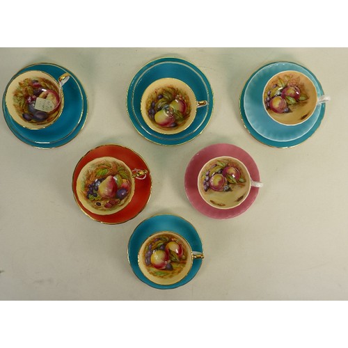 831 - A collection of early Aynsley Orchard Gold tea cups: In various colourways. (12)