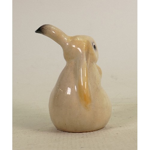 174 - Royal Doulton early seated lop eared rabbit: Decorated  in natural colours, height 10.5cm.