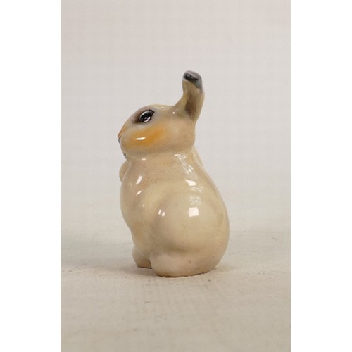 174 - Royal Doulton early seated lop eared rabbit: Decorated  in natural colours, height 10.5cm.