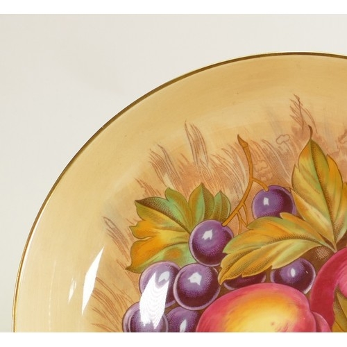 802 - A collection of Aynsley Orchard Gold items: Including large footed fruit bowl, 2 handled vase & cove... 