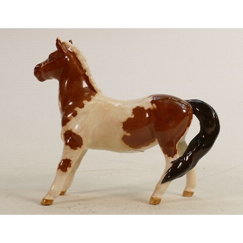 280 - Beswick Skewbald girls pony 1483: (Ear tip & back leg restored).