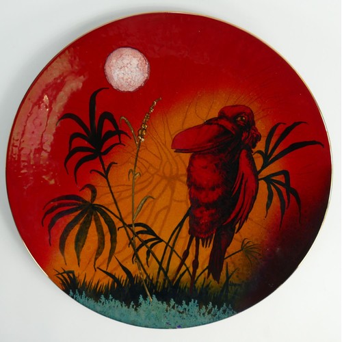 412 - Lyngard Simpson Artwares stunning reduction fired lustre charger: Decorated with a wading wally bird... 