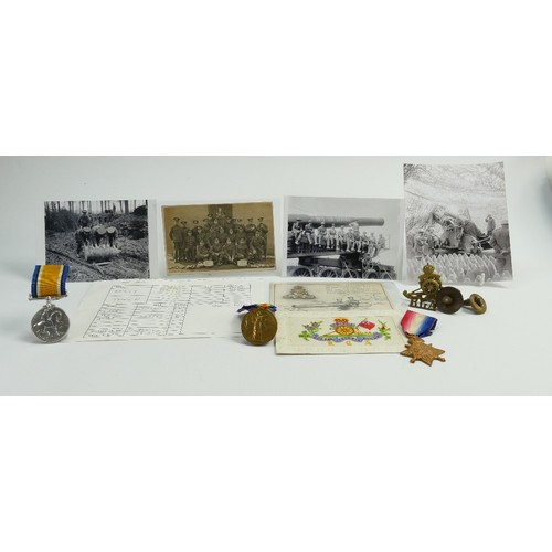 657 - A group of medals awarded to Gnr T.W.Bailey R.G.A: Three first world war medals together with photog... 