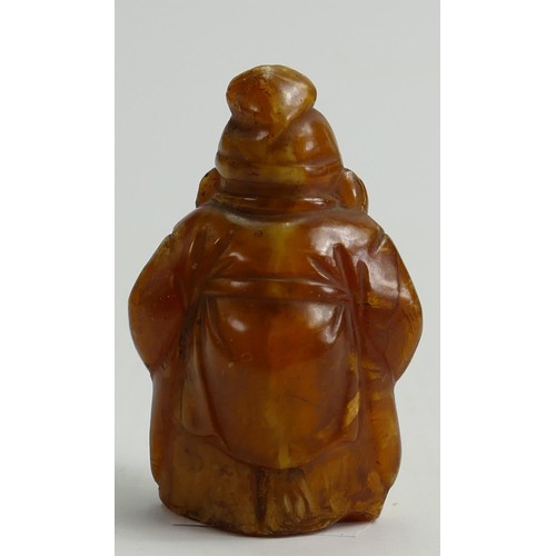 671 - 19th century carved amber Chinese Immortal figure: Height 5.5cm.