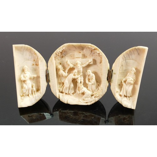 696 - 18/19th century Dieppe carved Ivory Triptych with religious scene: Diameter 5.5cm.

Please note that... 