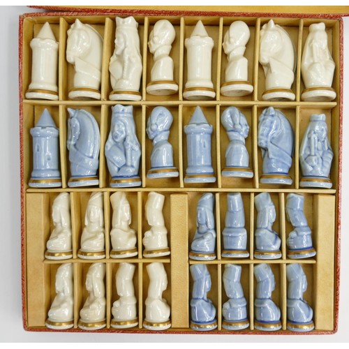 704 - A 20th century porcelain Limoges chess set: Boxed, height of King 7cm.