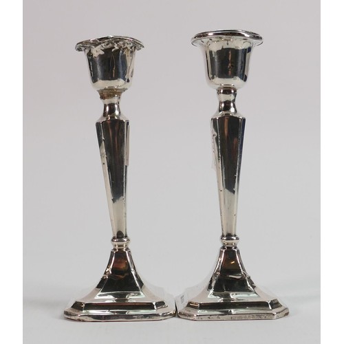 629 - Silver large vase and pair of silver candlesticks: All filled, gross weight 586g. (3)