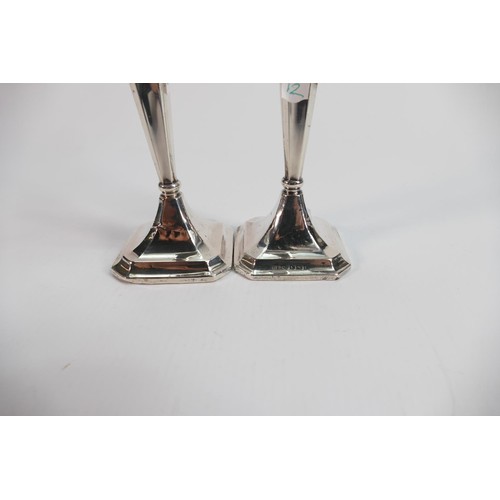 629 - Silver large vase and pair of silver candlesticks: All filled, gross weight 586g. (3)