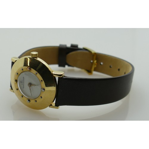 638 - Jaeger le Coultre 14ct gold vintage wristwatch: Gents/ladies dial diameter 3cm with leather strap.