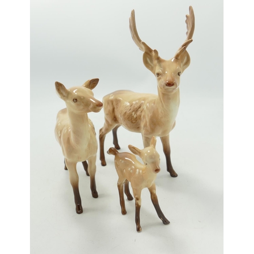 27 - Beswick Stag family group: stag standing, doe and fawn.