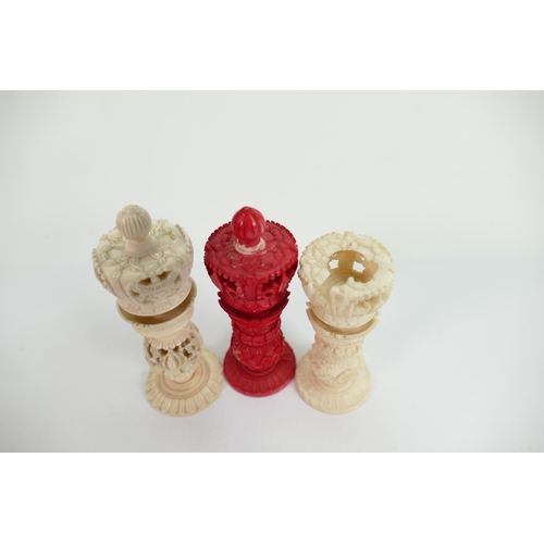 509 - A collection of early Bone Chess Pieces: tallest 9cm,damaged crown on white & top pommel of red crow... 