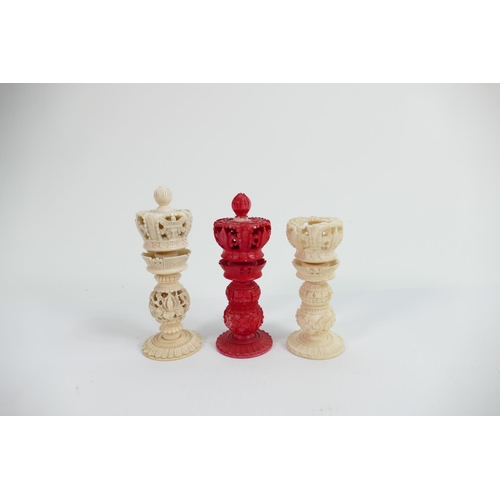 509 - A collection of early Bone Chess Pieces: tallest 9cm,damaged crown on white & top pommel of red crow... 