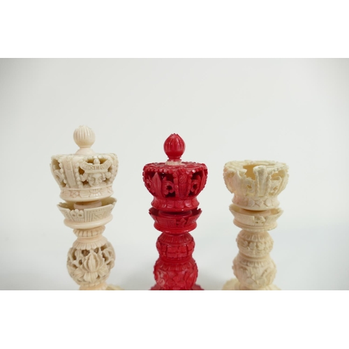 509 - A collection of early Bone Chess Pieces: tallest 9cm,damaged crown on white & top pommel of red crow... 