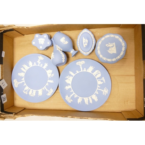 827 - A collection of Wedgwood Blue Jasperware to include: plates, vases & lidded boxes