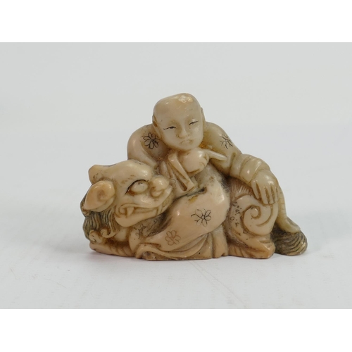 592 - 19th Century Chinese Carved Hardstone Figure of immortal seated upon lion dog : height 5.4cm