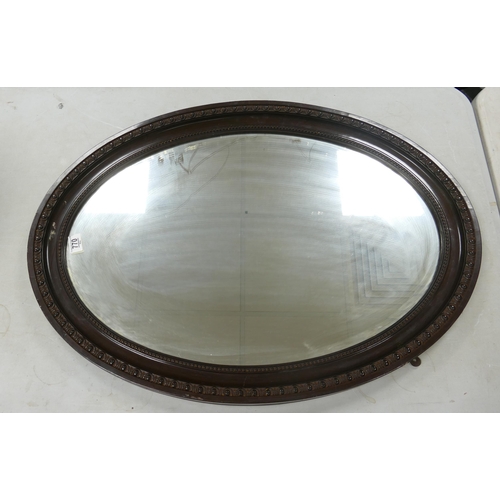 770 - Large Oval Bevel Edged Wall Mirror: diameter at widest 86cm