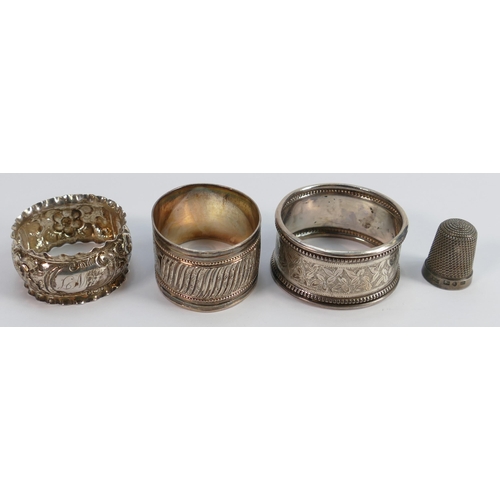 698 - Three silver hallmarked napkin rings & silver thimble: Gross weight 51g.