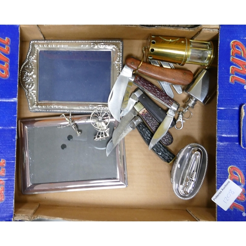 1208 - A mixed collection of items to include: Pocket Knives, Silver Picture frame, white metal Chinese orn... 