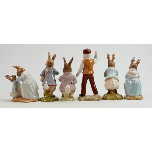 82 - Beswick BP10b Beatrix Potter figures: Mrs Rabbit Cooking, Mrs Rabbit and Peter, Peter with Postbag, ... 