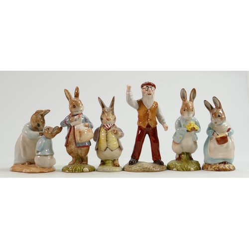 82 - Beswick BP10b Beatrix Potter figures: Mrs Rabbit Cooking, Mrs Rabbit and Peter, Peter with Postbag, ... 