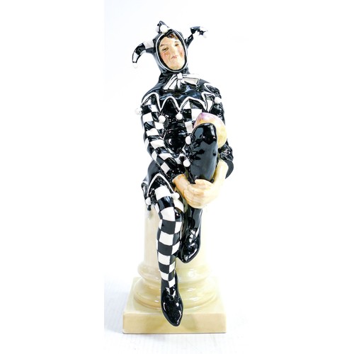 335 - Royal Doulton Jester HN45: In black & white chequered colour way, height 24cm.