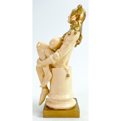 337 - Rare Royal Doulton Jester HN1295: In velum & gold, height 25cm - slight loss of gold to rear of base... 