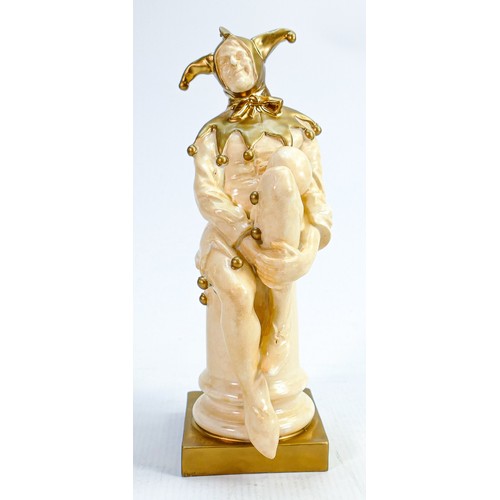 337 - Rare Royal Doulton Jester HN1295: In velum & gold, height 25cm - slight loss of gold to rear of base... 