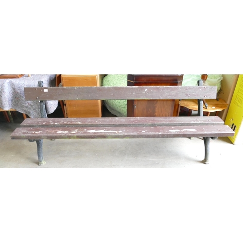 841 - Victorian Pine & Cast Iron Bench. Painted brown. H: 77cm, W: 211.7cm, D: 58cm