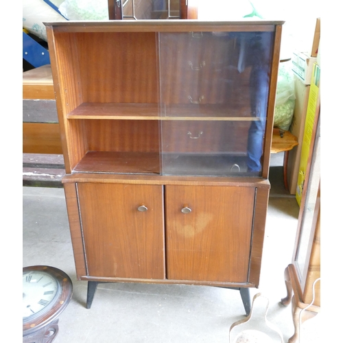 842 - Mid-century Mahogany Cabinet. Sliding glazed compartment to top, cupboard below containing shelves. ... 