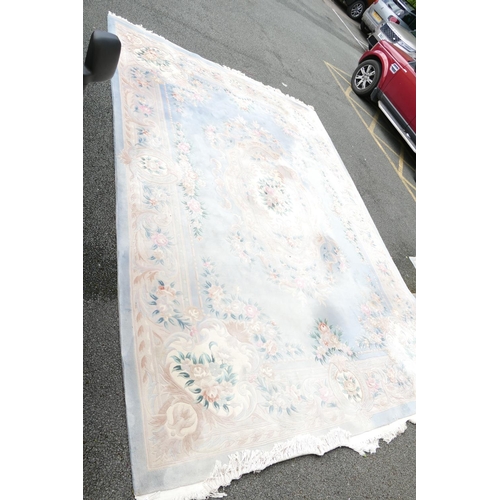 843 - Very Large Chinese Tasselled Rug: Some areas of fading noted. 334cm x 480cm, please be advised item ... 