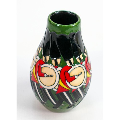 173 - Moorcroft trial vase decorated with drummer lifeguards all around: Dated 2014, h.13.25cm.