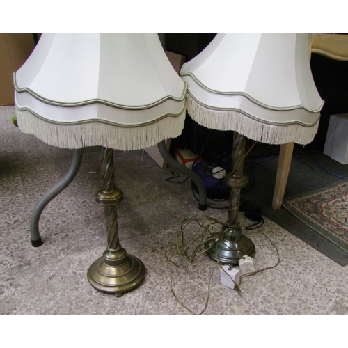 395 - Two brass table lights with twisted column supports (one with missing foot and no cable).