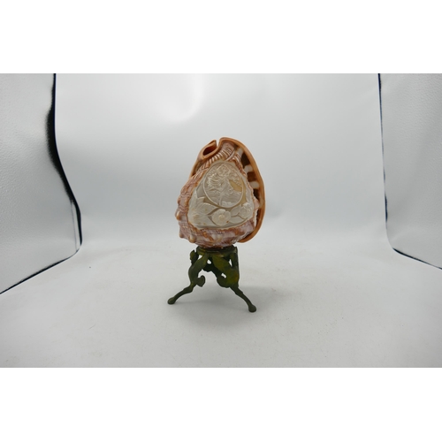 287 - Hand Carved Cameo on Conch Shell mounted on metal base, height 21cm