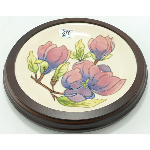 370 - Moorcroft Pink Magnolia on Cream Ground Framed Wall Plate, diameter of frame 30cm, silver lined seco... 