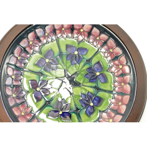 378 - Moorcroft Violets Pattern Framed Plate, Silver Line Seconds, diameter of Frame 30cm