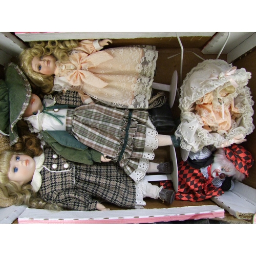 25 - A collection of dressed dolls, doll and pram and a clown (1 tray).