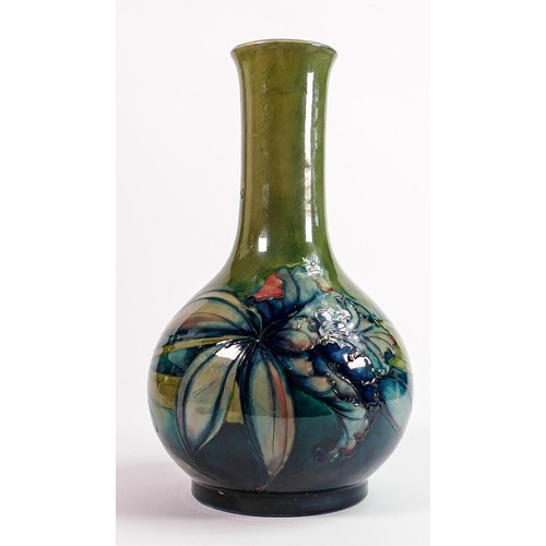 32 - William Moorcroft vase decorated in the Iris design: On green ground, c1930, full signature & impres... 