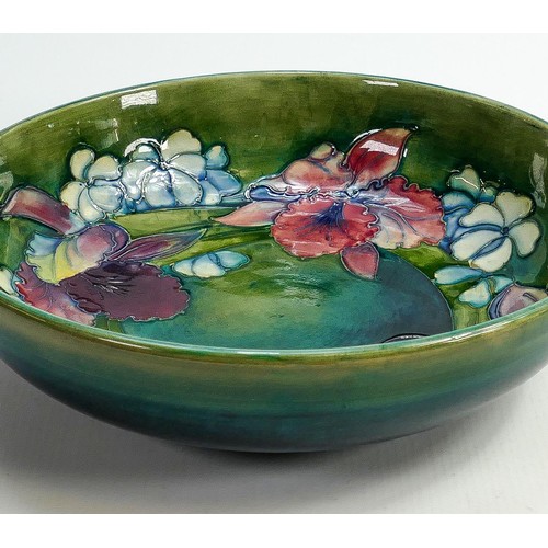 33 - Walter Moorcroft large dish decorated in the Orchid design: Diameter 27cm.