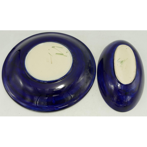 201 - Walter Moorcroft Anemone oval dish and Magnolia round plate, d.25cm. (2)